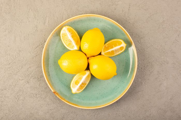 Top View Yellow Fresh Lemons Ripe Mellow Juicy Whole Sliced Inside Green Plate Grey Background Fruits Citrus Color