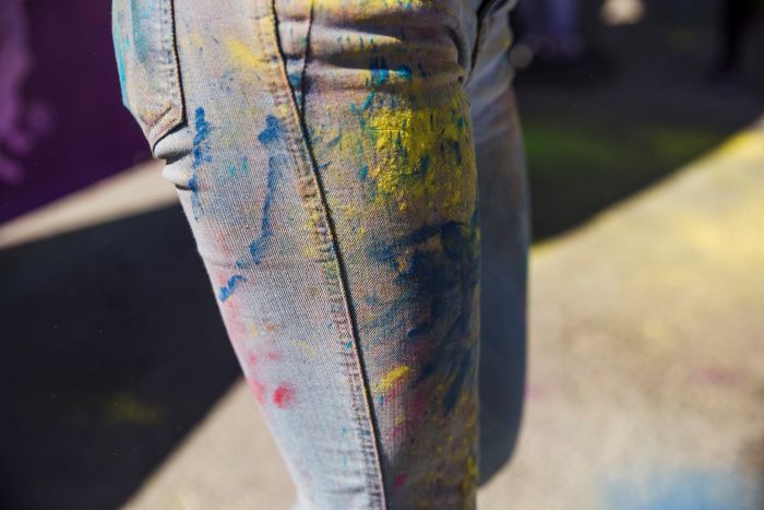 Close Up Woman S Jeans With Holi Color Powder