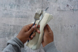 Person Hand Cleaning Drying Cutlery With Towel 2