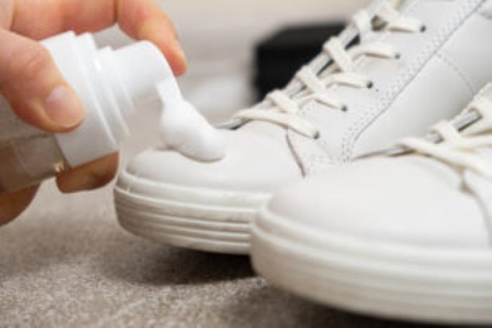 Applying Cleaning Foam From Bottle White Leather Women S Sneakers 300X200 1