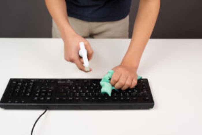 Cleaning Computer Keyboard Office Spraying Water With Spray Bottle Dusty Dirty Electronic 300X200 1