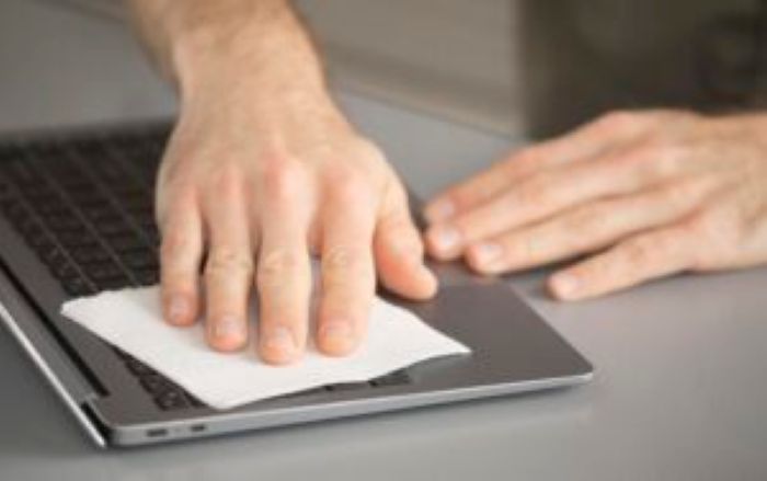 Employee Disinfecting Electronic Device 300X188 1