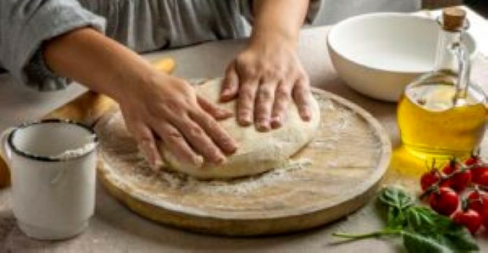 Female Cook Preparing Pizza Dough 300X156 1