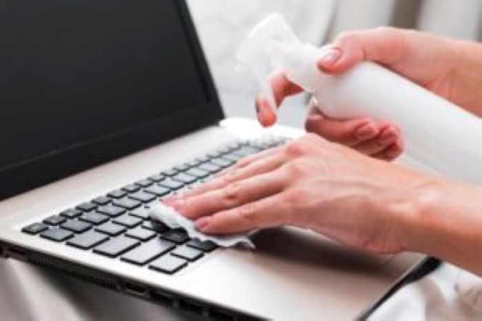 Hands Disinfecting Laptop Keyboard Surface 300X200 1