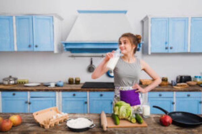 Young Woman Drinking Milk From Bottle 300X200 1