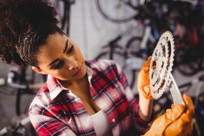 Mechanic Holding Bicycle Gear