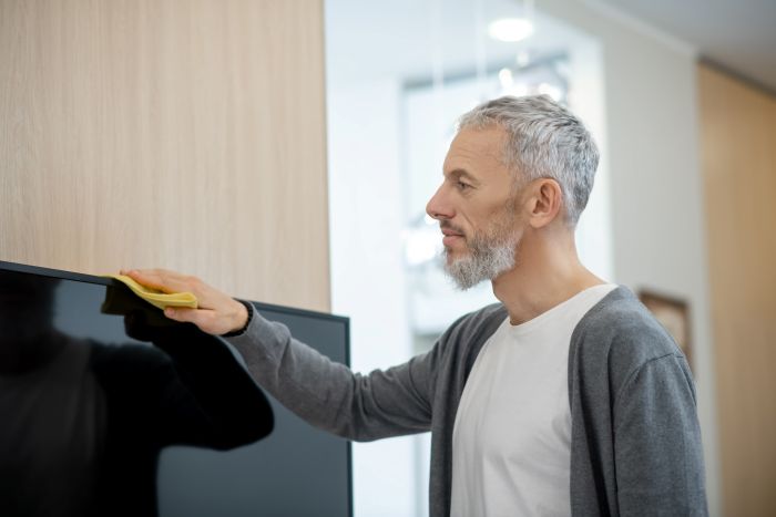 Housework Bearded Man Cleaning House Looking Involved