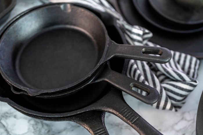 Variety Cast Iron Frying Pans Marble Background