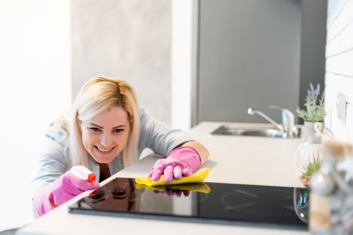 Cute Housewife Cleaning Kitchen