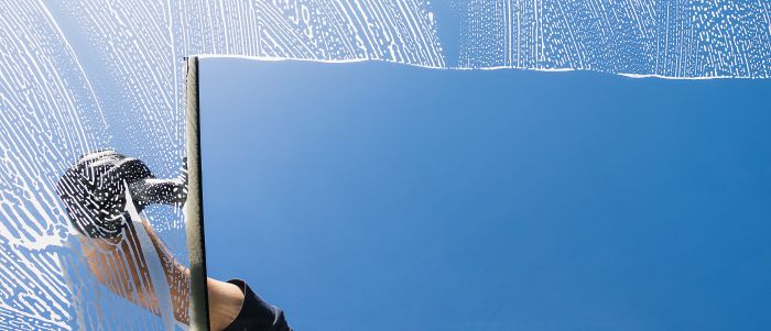 Window Cleaner Cleaning Window With Squeegee Wiper Sunny Day With Copyspace Your Individual