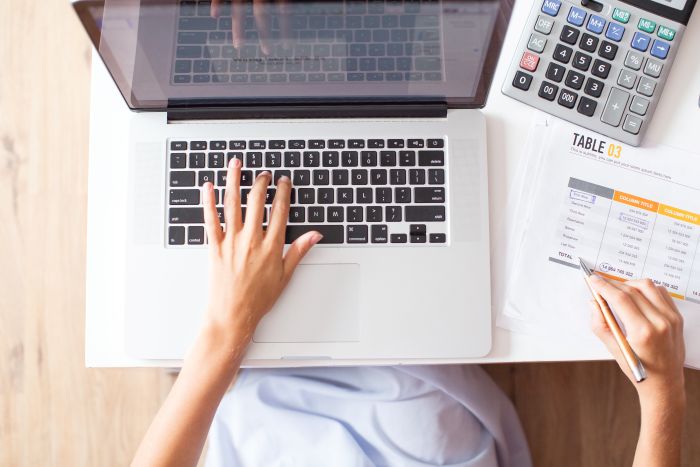 Cropped View Accountant Working Laptop