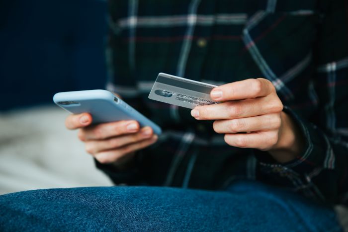 Online Shopping Internet Concept Woman Using Credit Card Smartphone