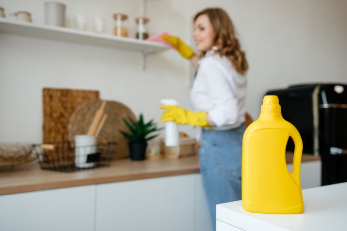 Beautiful Girl Wipes Shelves Kitchen