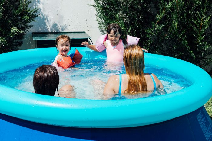 Couple Lesbian Women Bathe Pool With Their Daughters Wearing Muffs Summer
