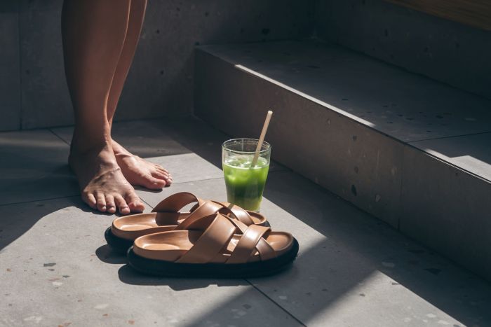 Summer Composition With Slippers Lemonade Female Legs
