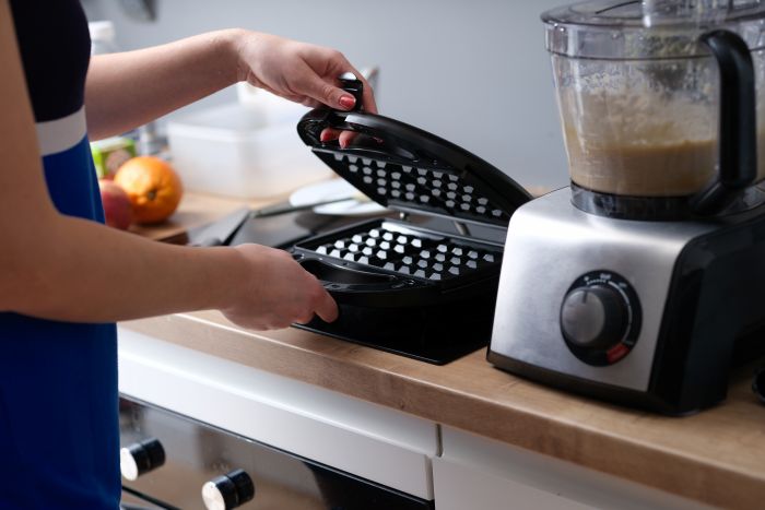 Woman Preparing Belgian Waffle Maker Kitchen