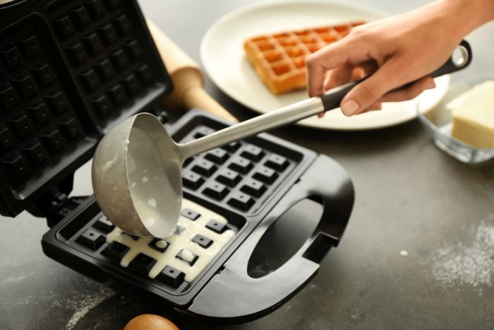Woman Preparing Wafers Waffle Iron Home