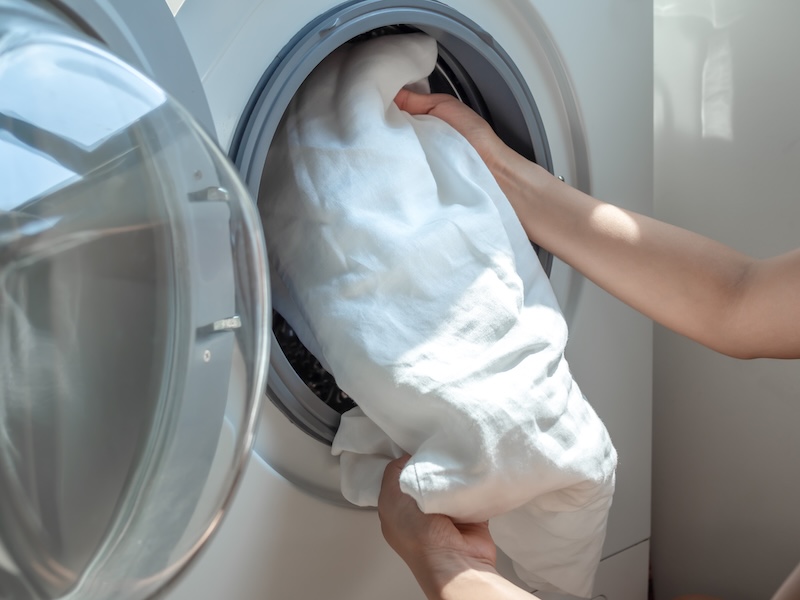 Woman S Hand Putting Dirty White Linen Shirt Washing Machine
