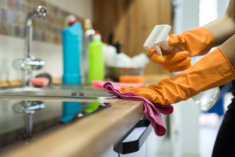 Woman While Cleaning Surface Kitchen Desk With Sponge Her Rubber Gloves Housework