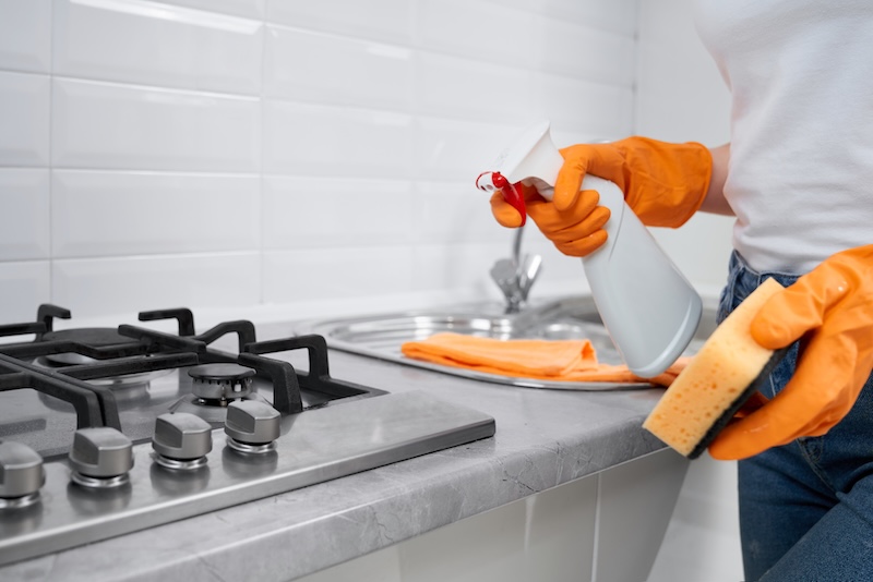 Woman Holding Rag Detergent Cleaning Cooker