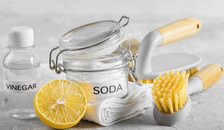 front view of eco-friendly cleaning brushes with lemon and baking soda