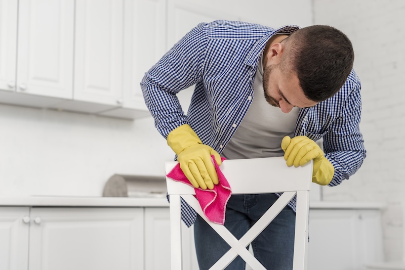 Man Cleaning Chair
