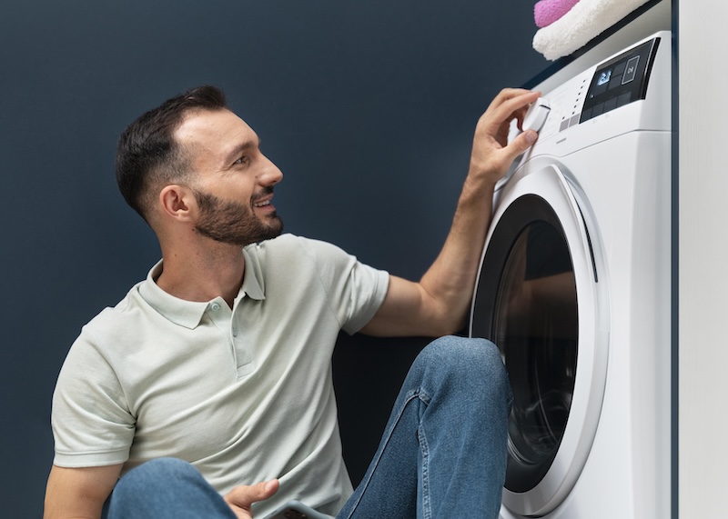 Man Waiting Washing Machine Finish Its Program